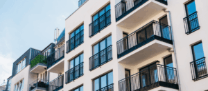 upscale apartment building exterior with balconies and view of the sky